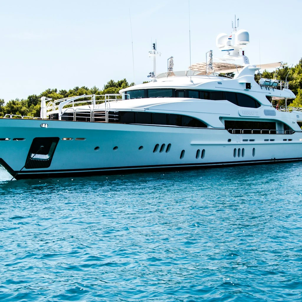 Luxury Ocean Superyacht Cruising at Sunset